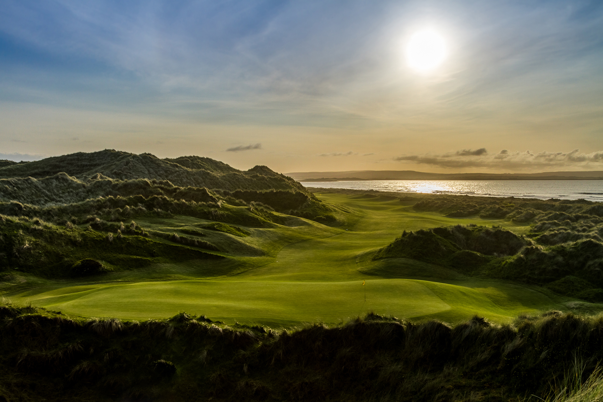 Links golf course in the dunes at sunset on the Irish coast